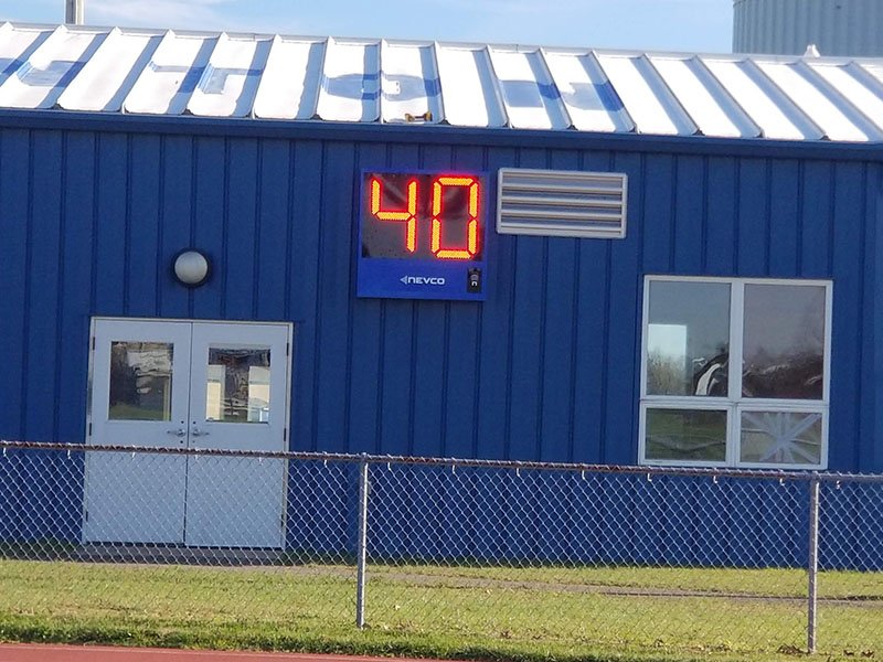 End-of-period light mounted on scoreboard