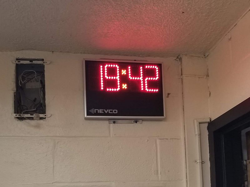 Indoor gym scoreboard with shot clocks